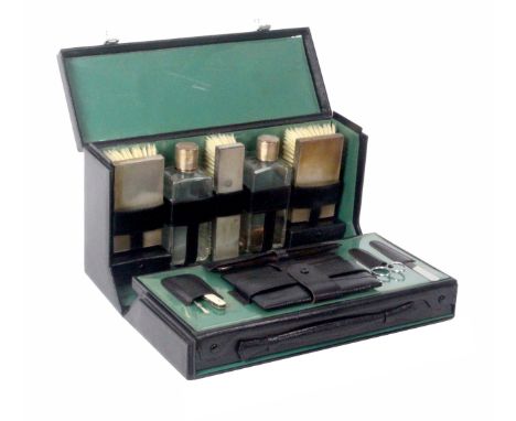 Asprey - London, a gentleman's compactus, 1965, in black morocco with silver fittings, the hinged lid with handle and initial