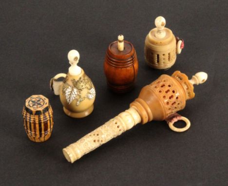 Five tape measures, comprising a Tunbridge stick ware example of barrel form, lacking tape, 2.7cms, a boxwood barrel form exa