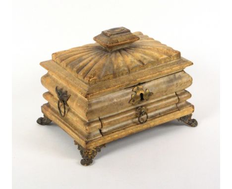An unusual gilt tooled vellum covered sewing box, circa 1820, of complex sarcophagal form with fan form lid centred by a rais