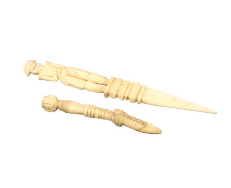 Two late 18th Century/early 19th Century bone objects, probably French Prisoner of War work, comprising a pipe tamper the ter