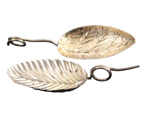 Two silver caddy spoons, both with oval leaf decorated bowl with wire work encircled handle, one with lion and kings duty mar