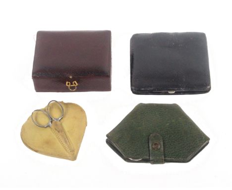 Four small leather sewing companions, each with a selection of tools and accessories, largest 9cms.&nbsp; &nbsp; (4) &nbsp; &