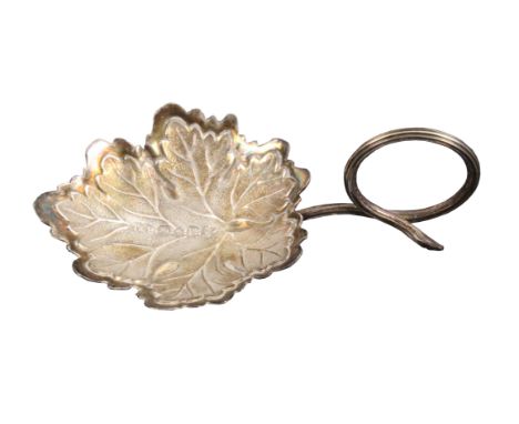 A silver caddy spoon, the leaf form bowl with encircled snake style handle, Birmingham, 1840, by Taylor and Perry, 7.2cms.&nb