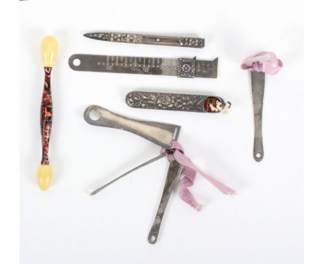 A group of American 'sterling' white metal sewing tools, comprising three graduated ribbon threaders, 6.5cms, another engrave