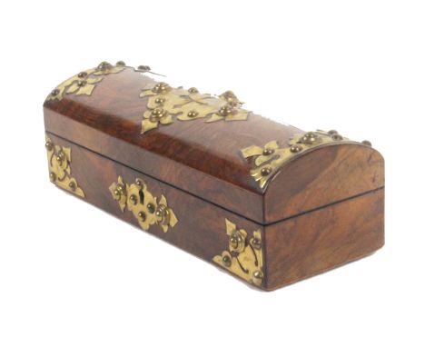 A mid Victorian figured walnut and brass mounted sewing box, the front and domed lid applied with cut and engraved gilt brass