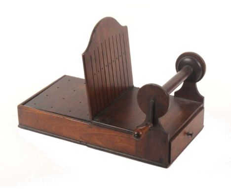 An unusual Georgian mahogany table or braiding loom of rectangular form, one end fitted with a drawer the other with a hinged