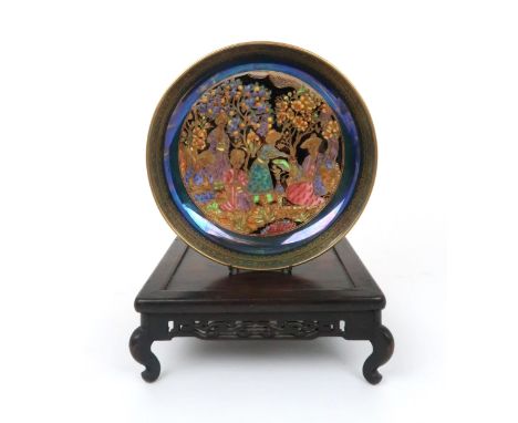 DAISY MAKEIG-JONES FOR WEDGWOOD - A FAIRYLAND LUSTRE NIZAMI PATTERN DISH the coloured and gilt design of Eastern figures and 