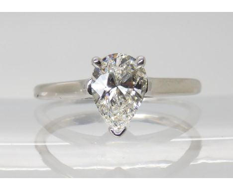 A TIFFANY PLATINUM & DIAMOND RING set with a 1.06ct pear shaped diamond, in classic three claw setting. the inner shank inscr