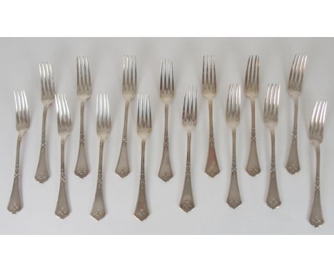 A PART SUITE OF FRENCH 950 STANDARD SILVER CUTLERY probably Paris late 19th/early 20th century in Louis xv style, double stru