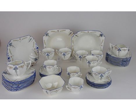 A SHELLEY ART DECO QUEEN ANNE BLUE IRIS TEA AND DESSERT SET comprising two serving bowls, twelve dishes, twelve plates, nine 