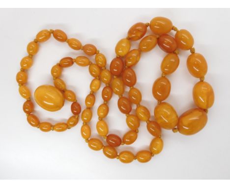 A STRING OF BUTTERSCOTCH COLOUR AMBER BEADS  strung length 97cm, weight 74.6gms (with one spare loose bead) Condition Report: