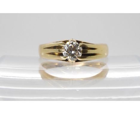 A BRIGHT YELLOW METAL DIAMOND SOLITAIRE RING  set with a estimated approx 0.60ct brilliant cut diamond. Finger size R, weight