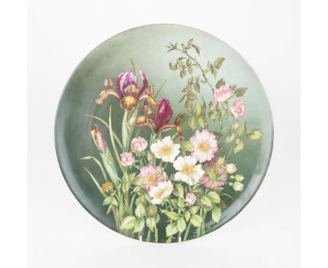 A BROWN WESTHEAD MOORE &amp; CO POTTERY CHARGER  painted with irises and dog roses, 37cm diameter, impressed mark to back and
