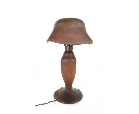 A DAUM NANCY MOTTLED GLASS TABLE LAMP in mottled shades of green and pink, with hammered metal mounts, 47cm high Condition Re