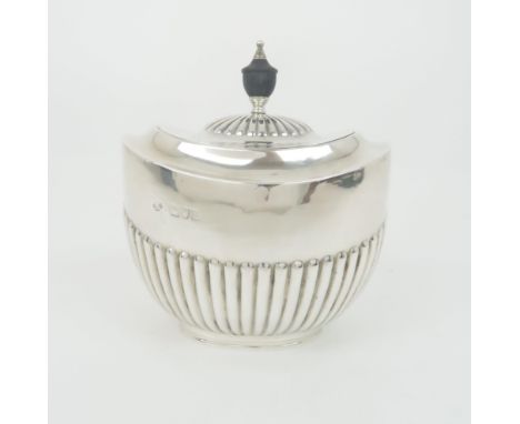 A SILVER TEA CADDY unclear maker's marks London 1901 of oval form with hinged cover and half ribbed body 13 cm high 187 grams