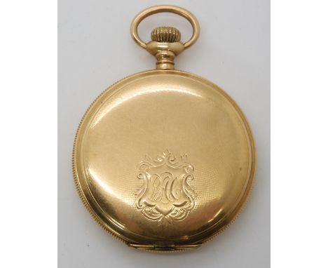 A 14K GOLD ELGIN POCKET WATCH white enamel dial with subsidiary seconds dial, black Arabic numerals and hands. Engine turned 