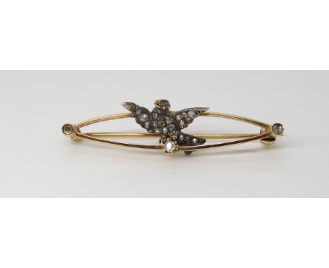 A DIAMOND SET DOVE BROOCH  mounted in yellow metal, the dove is set with old and rose cut diamonds with a ruby eye. Dimension