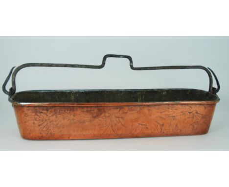 A LARGE COPPER FISH KETTLE possibly French decorated with a landscape scene and stamped B, with swing handle, 83cm long Condi