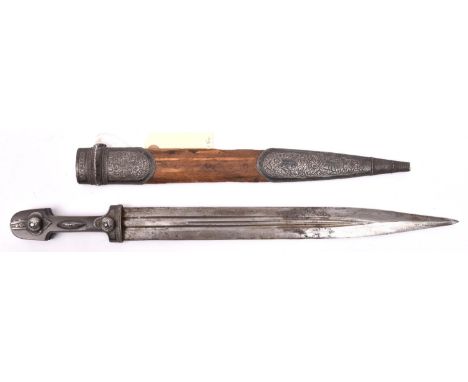 A 19th century kindjal, triple fullered blade 13½”, darkened horn grips, wtih engraved Eastern silver mounts incorporating 2 