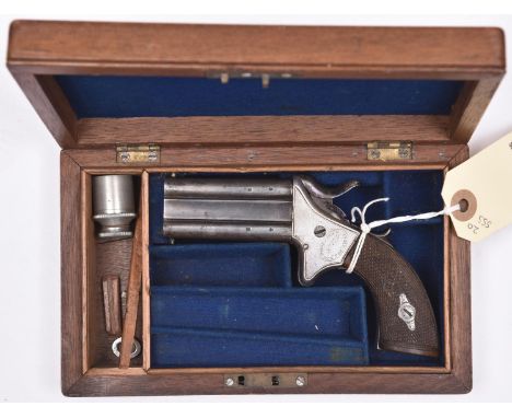 A cased .38” rimfire Woodward’s patent double barrelled over and under turnover pistol, number 774, 4½” overall, barrels 2¼ w