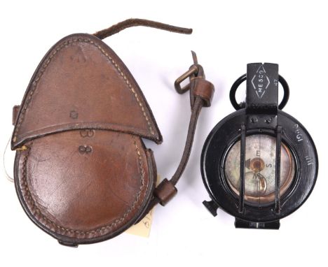 A British military issue Mark III prismatic marching compass,  with shiny black lacquered finish, stencilled in white “Jul 19