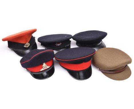 6 peaked caps, including ERII R M Police, ERII Women’s R Artillery and London Fire Brigade, remainder without badges. GC 