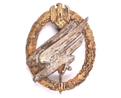 A Third Reich Army Parachutists badge,  of heavy construction with matt finish to gilt wreath and silver eagle, round pin wit