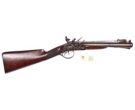 A rare early 19th century double barrelled flintlock blunderbuss with spring bayonet, by Jackson, London,  27½” overall, swam