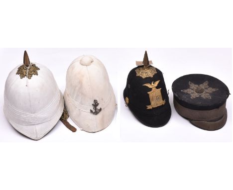 A US military cadet’s blue cloth spiked helmet, brass top mount and spike, HP with “10” in shield and devices, eagle above, s