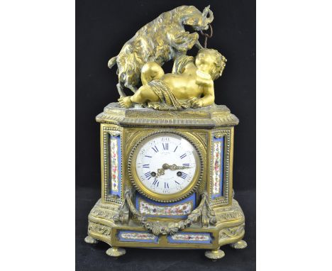 Ornate French gilt and enamel mantle clock topped with a cherub and a ram, key present. Ht 41cms Face signed Miroy Freres Bre