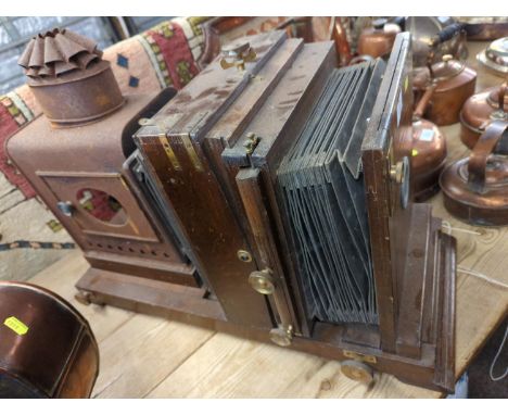 Magic Lantern with wooden casing, leather bellows. Metal housing where lighting is powered with paraffin surrounding compound