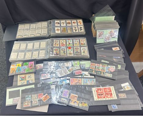 Selection of vintage cigarette cards and stamps 