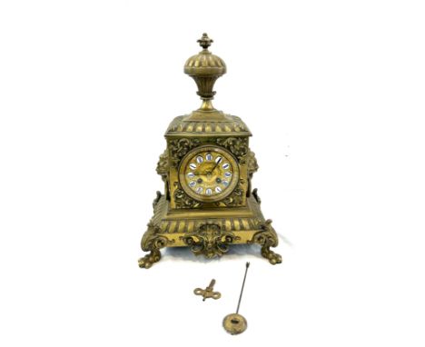 Vintage brass 2 key hole mantel clock with key and pendulum, approximate measurements Height 17 inches, Width 11 inches 