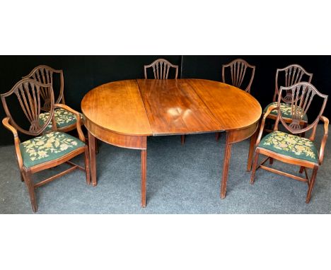 A Regency mahogany D-end dining table, with set of six mahogany dining chairs, including pair of carver chairs, wheat-sheaf s