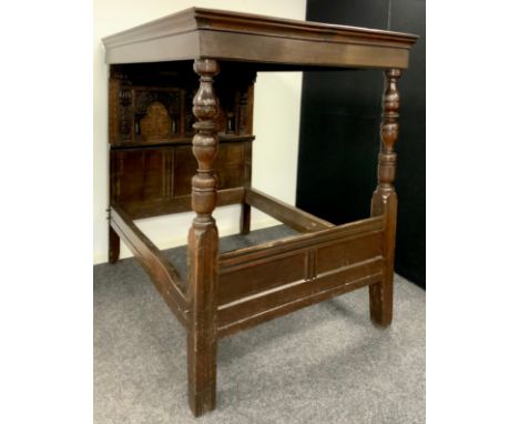 A&nbsp; James I carved and inlaid oak full tester bed. The oak panelled tester with carved square centre boss. The headboard 