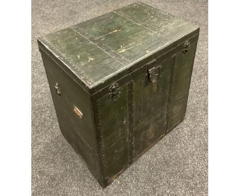 A late 19th/early 20th century wooden linen and metal strap bound steamer trunk, deep green fabric outer with black iron work