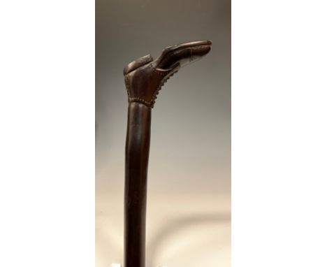 A 19th century walking stick / walking cane, the handle carved as an ankle boot, 100cm high. 