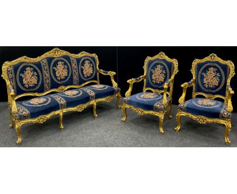 A Louis XIV style carved gilt-wood effect sofa, and pair armchairs, the sofa measuring 121cm high x 191cm wide x 70cm deep. 