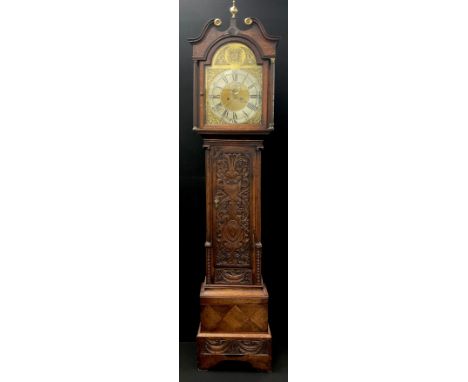 A 19th century carved oak cased eight day longcase clock, unnamed arched sunburst gilt dial with silvered chapter ring, Roman