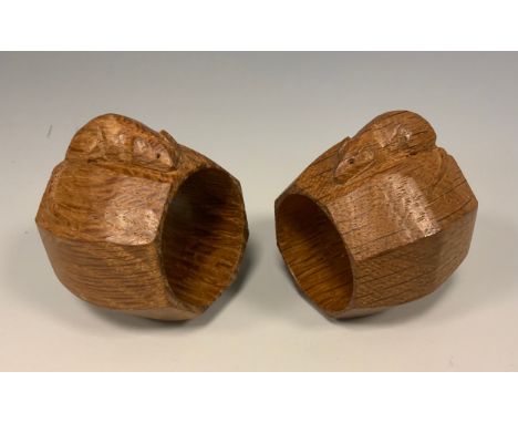 A pair of Robert Thompson of Kilburn Mouseman napkin rings, of octagonal form, each with carved mouse signature, measuring 5.