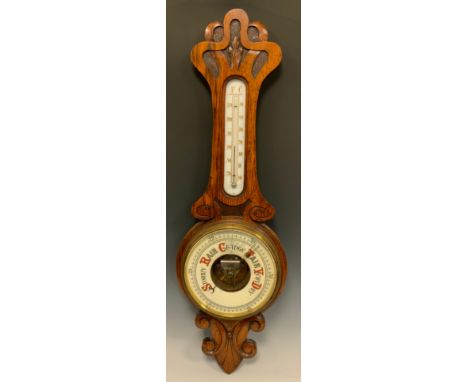 An Art Nouveau carved oak framed aneroid barometer, cream register, 81cm long 