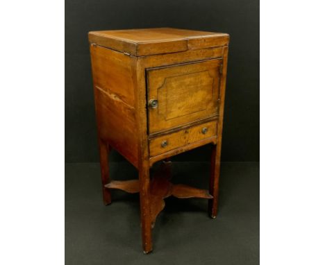 A George III mahogany bedside wash-stand cabinet, the pair of hinged doors to top lifting to reveal a recessed top, and draw-