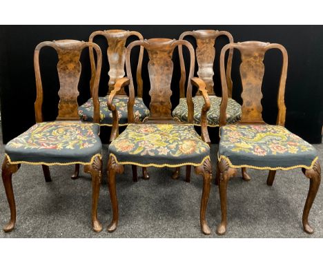 A set of five Queen Anne style walnut dining chairs, tapestry upholstered seats, scallop shell carved forelegs, seats 47cm hi