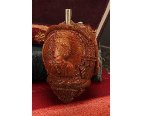 Snuff - a 19th century novelty coquilla nut bugbear snuff flask, carved with oval portrait cameos within stylized leaves, met
