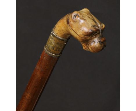 A 19th century novelty walking stick, the handle carved with the head of a boxer, hardwood shaft, 89cm long, c.1880 