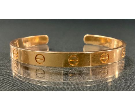 Cartier - an 18ct gold Love bangle, open back, marled Cartier, 17, *1TO, 750, FN3171, 6.5mm wide, 25.2g, original pouch case.
