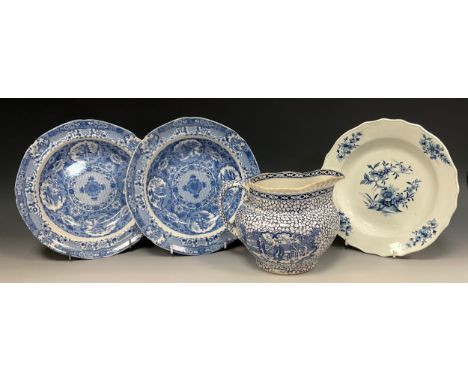 A 18th century Tournay blue and white soup bowl, painted with floral panels in under glazed blue, crossed marks verso, probab