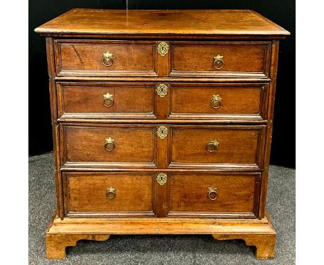 A Queen Anne oak chest of four graduated drawers, of split construction, panelled sides, stepped base with bracket feet, 108c