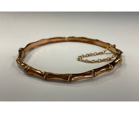 An Edwardian 9ct gold vertebrate link hinge bangle, Birmingham 1901, 6.2g 
