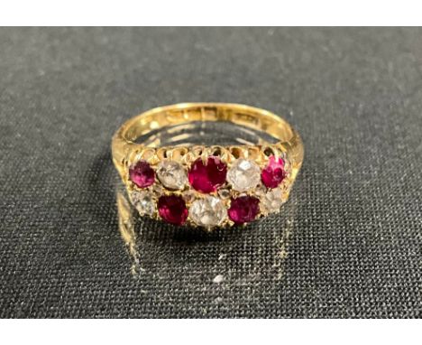 A ruby and diamond chequered ring, set with five cushion and four rose cut diamonds and five red rubies, total estimated ston